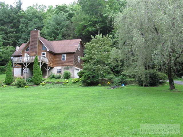 3192 Wildcat Road Deep Gap, NC 28618 - Photo 17 of 24 a front view of a house with a yard