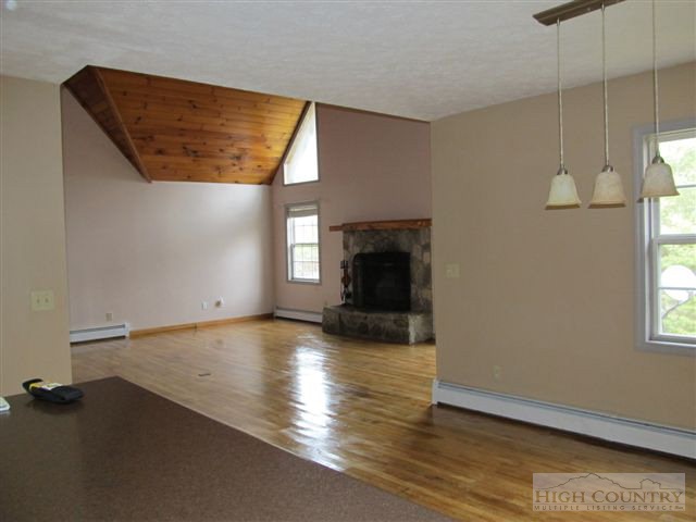 3192 Wildcat Road Deep Gap, NC 28618 - Photo 23 of 24 wooden floor in an empty room with a window
