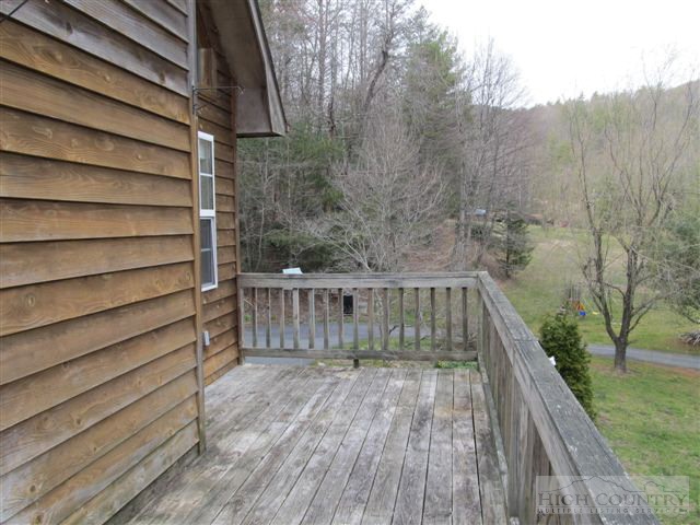3192 Wildcat Road Deep Gap, NC 28618 - Photo 10 of 24 a view of balcony with wooden floor and fence