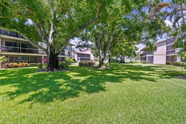 a view of a house with a big yard