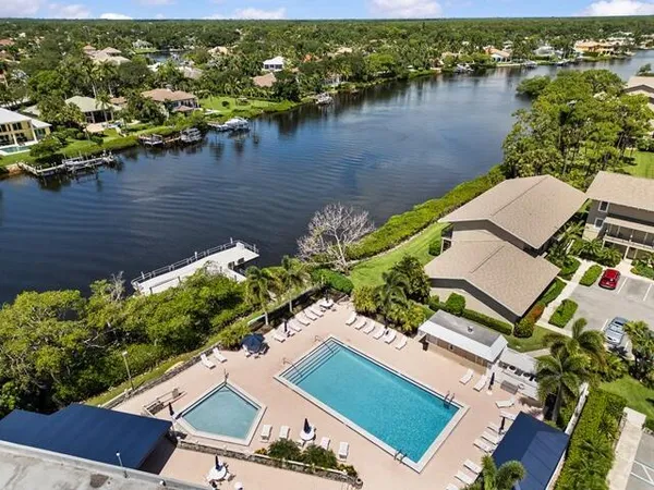 an aerial view of a house with a lake view
