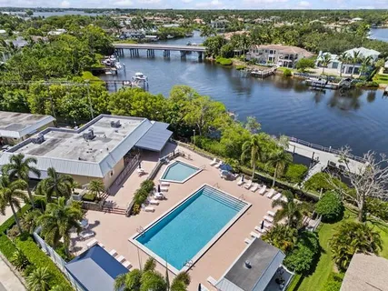 an aerial view of a house with a lake view