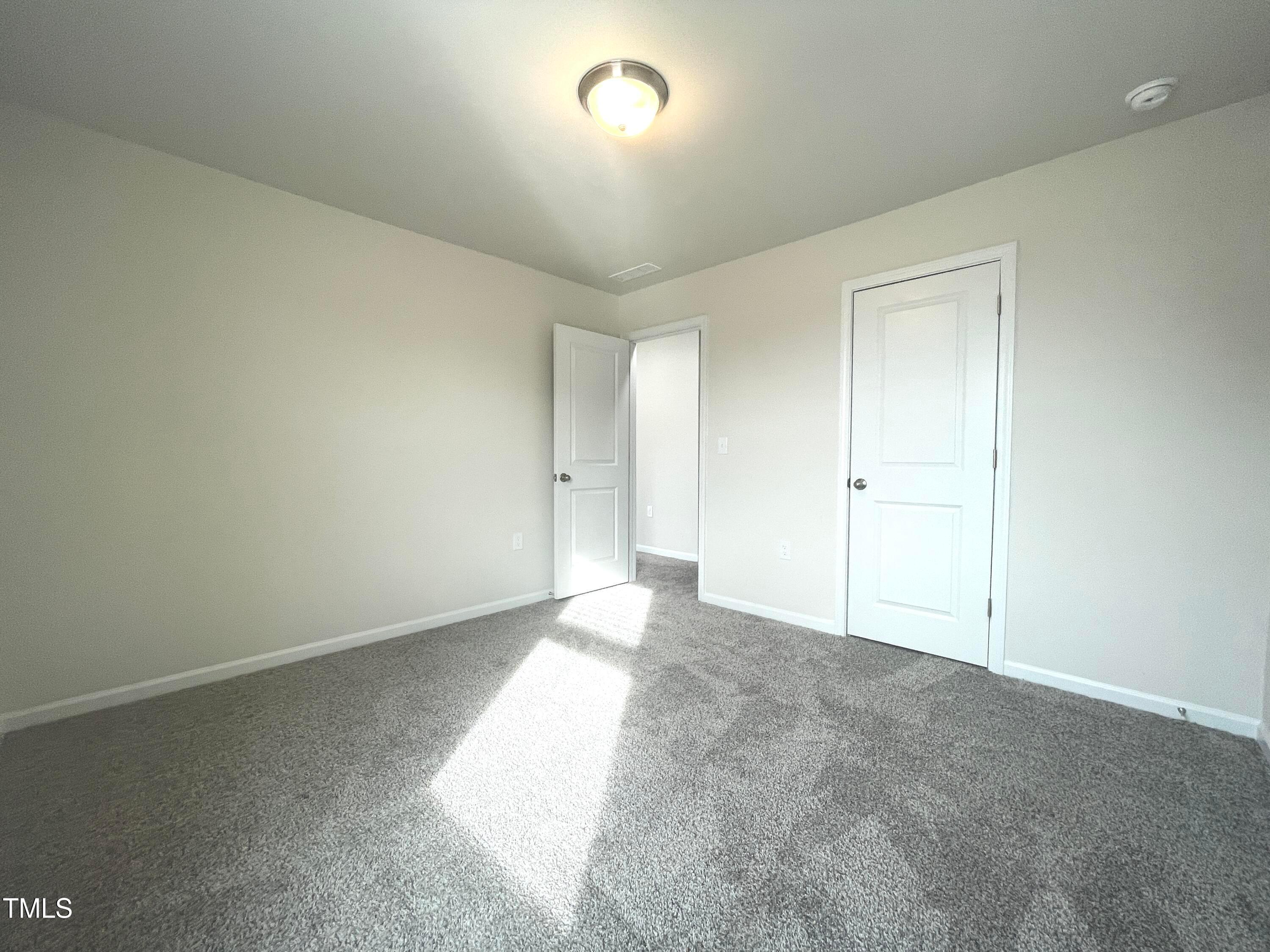 119 Red Valor Street Garner, NC 27529 - Photo 16 of 27 a view of an empty room and a window