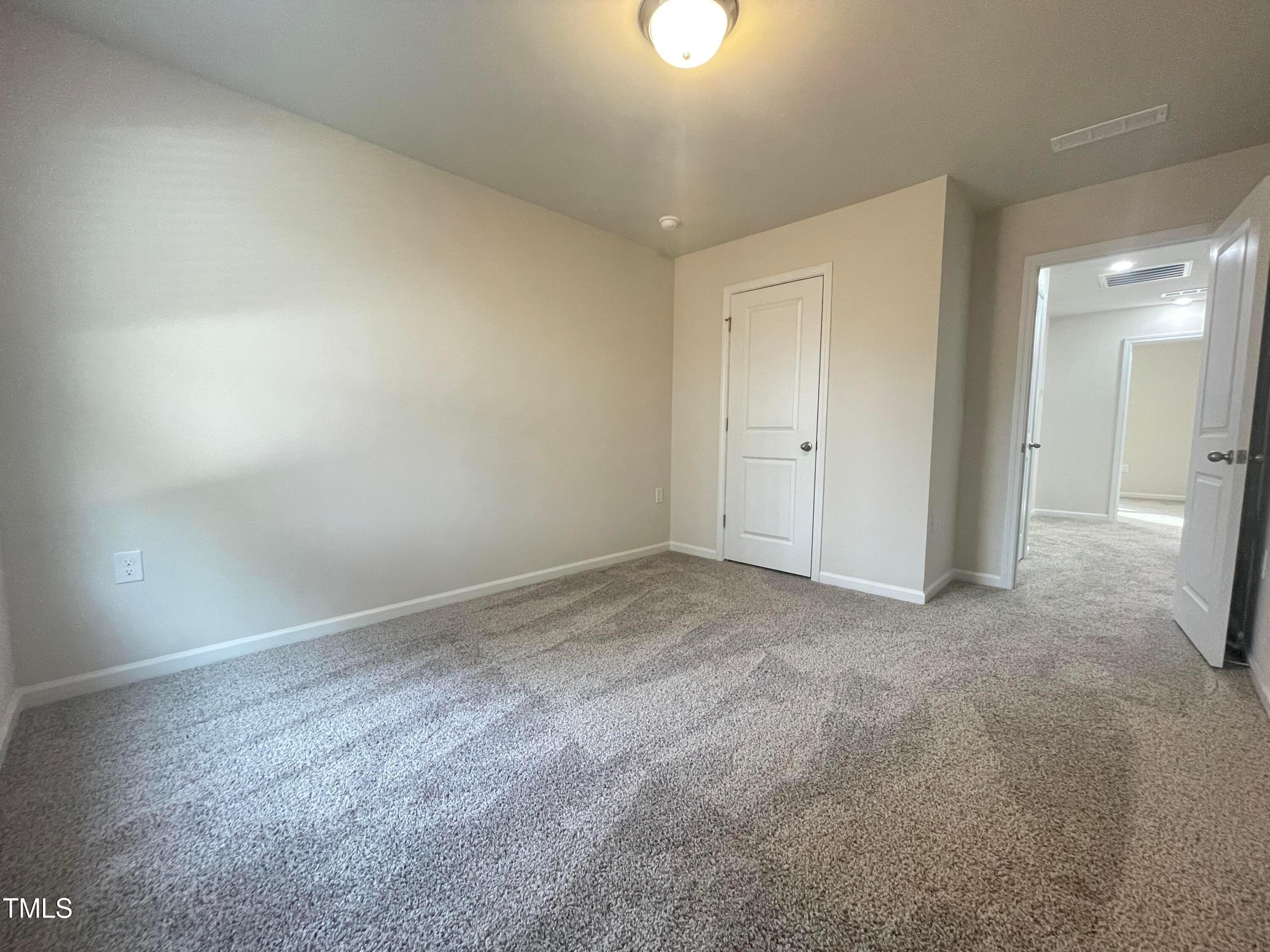 119 Red Valor Street Garner, NC 27529 - Photo 18 of 27 an empty room with a natural light