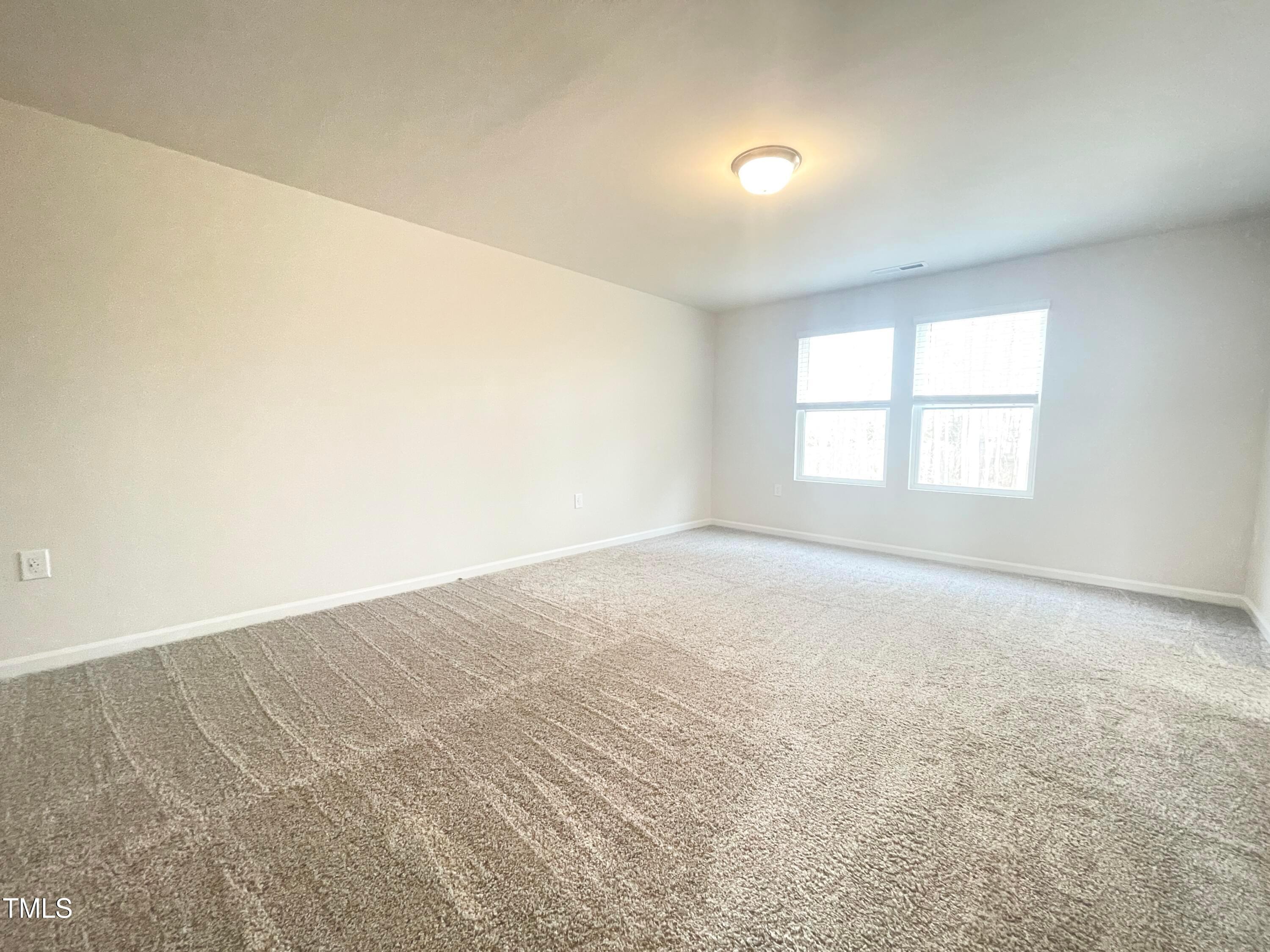 119 Red Valor Street Garner, NC 27529 - Photo 19 of 27 an empty room with a window