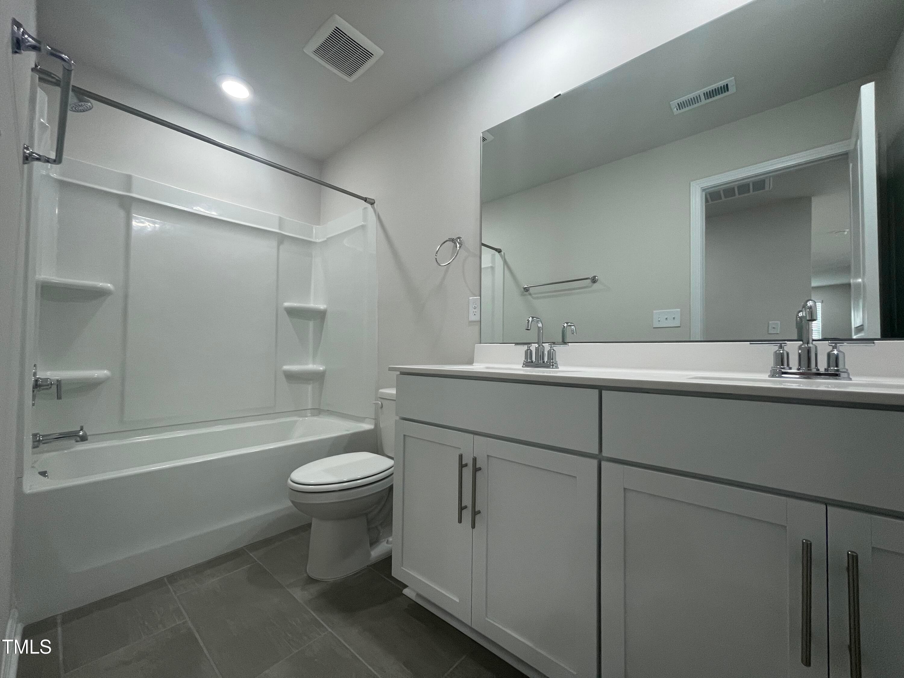 119 Red Valor Street Garner, NC 27529 - Photo 21 of 27 a bathroom with a sink a toilet and shower
