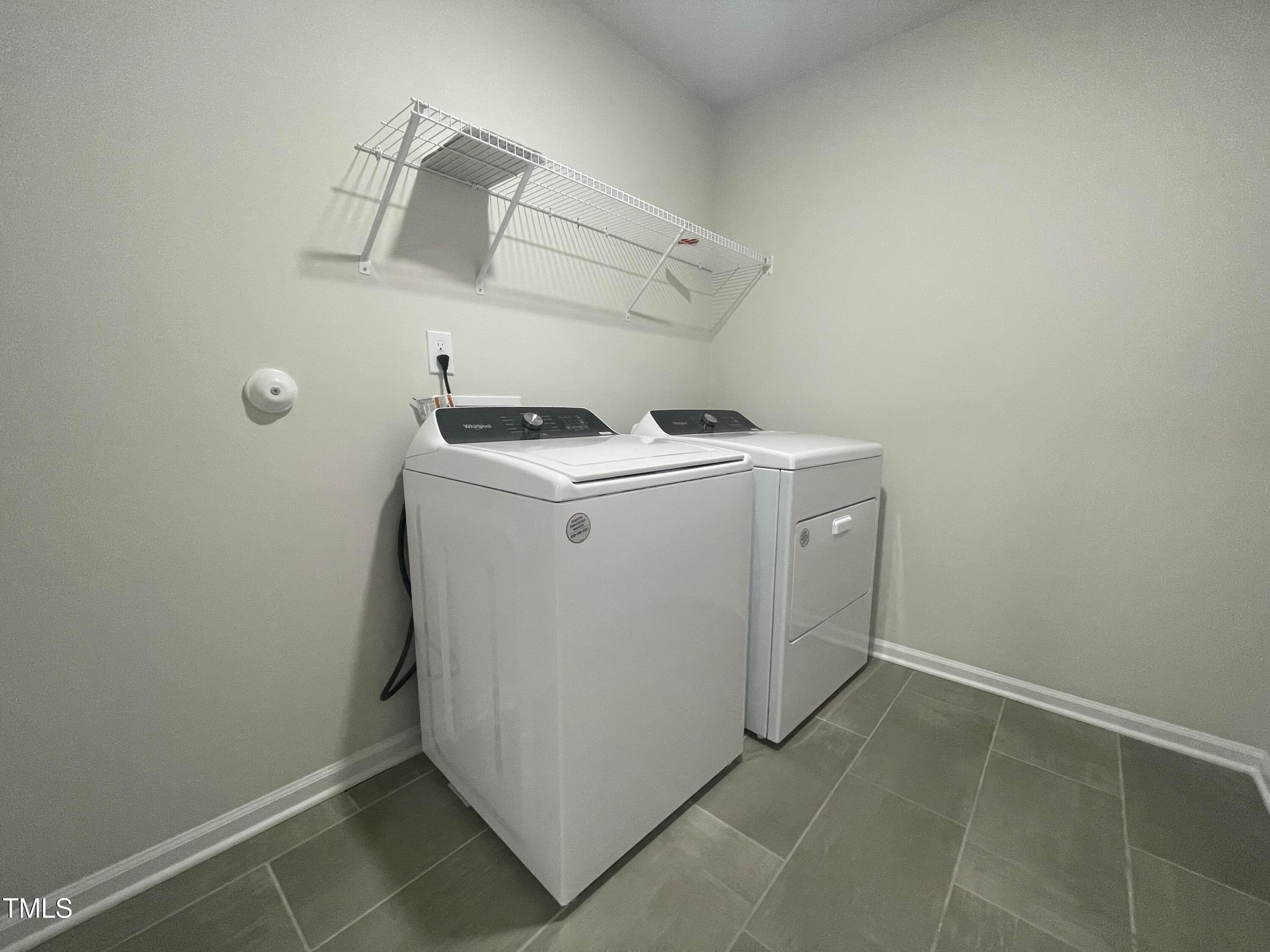 119 Red Valor Street Garner, NC 27529 - Photo 25 of 27 a utility room with dryer and washer