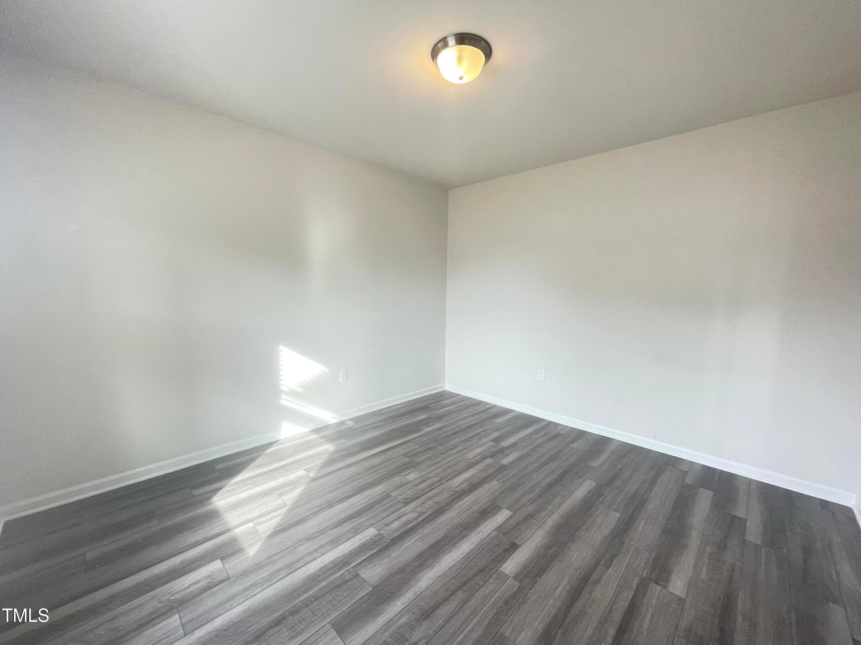 119 Red Valor Street Garner, NC 27529 - Photo 3 of 27 a view of empty room with wooden floor