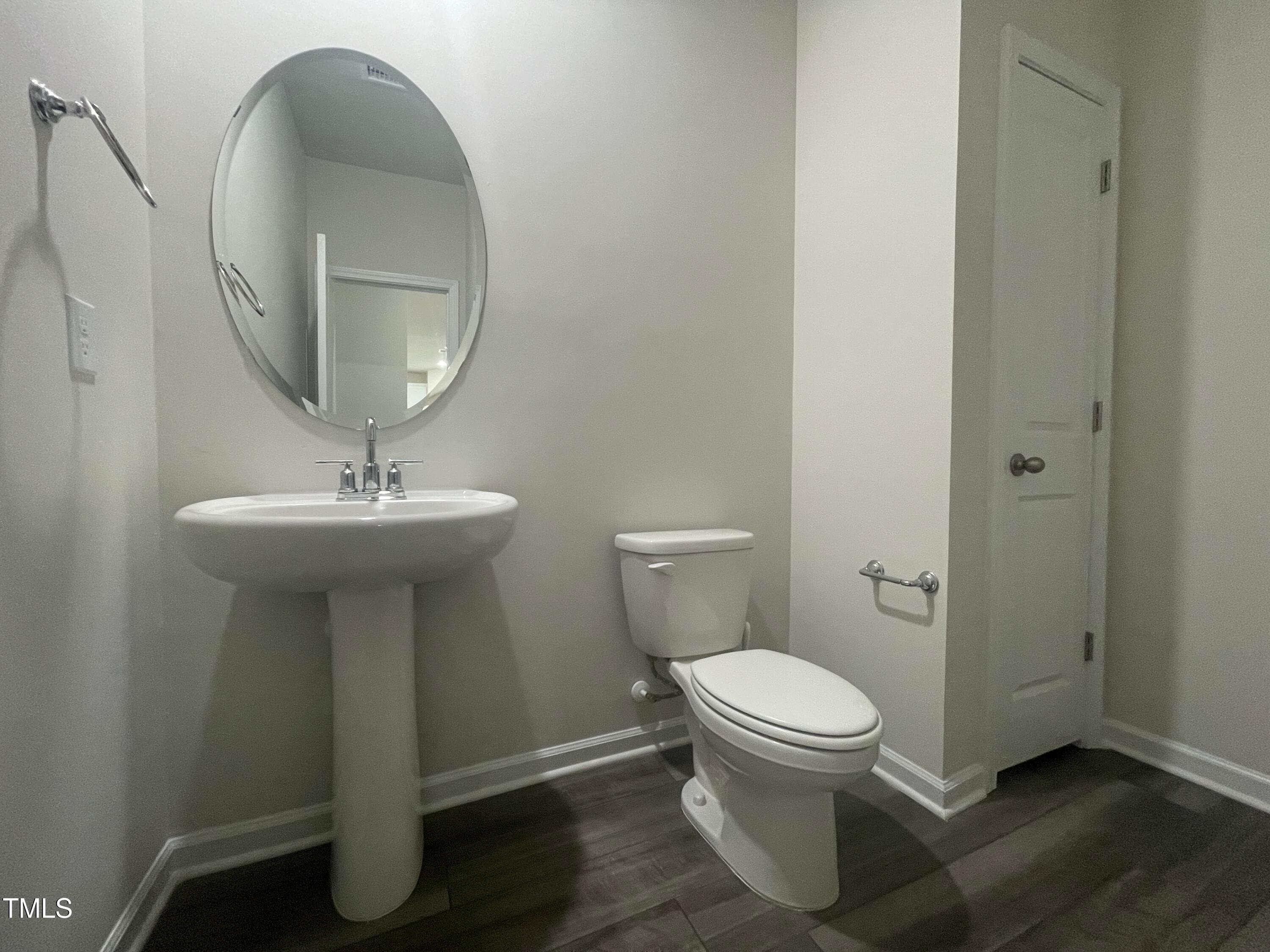 119 Red Valor Street Garner, NC 27529 - Photo 8 of 27 a bathroom with a sink toilet and a mirror