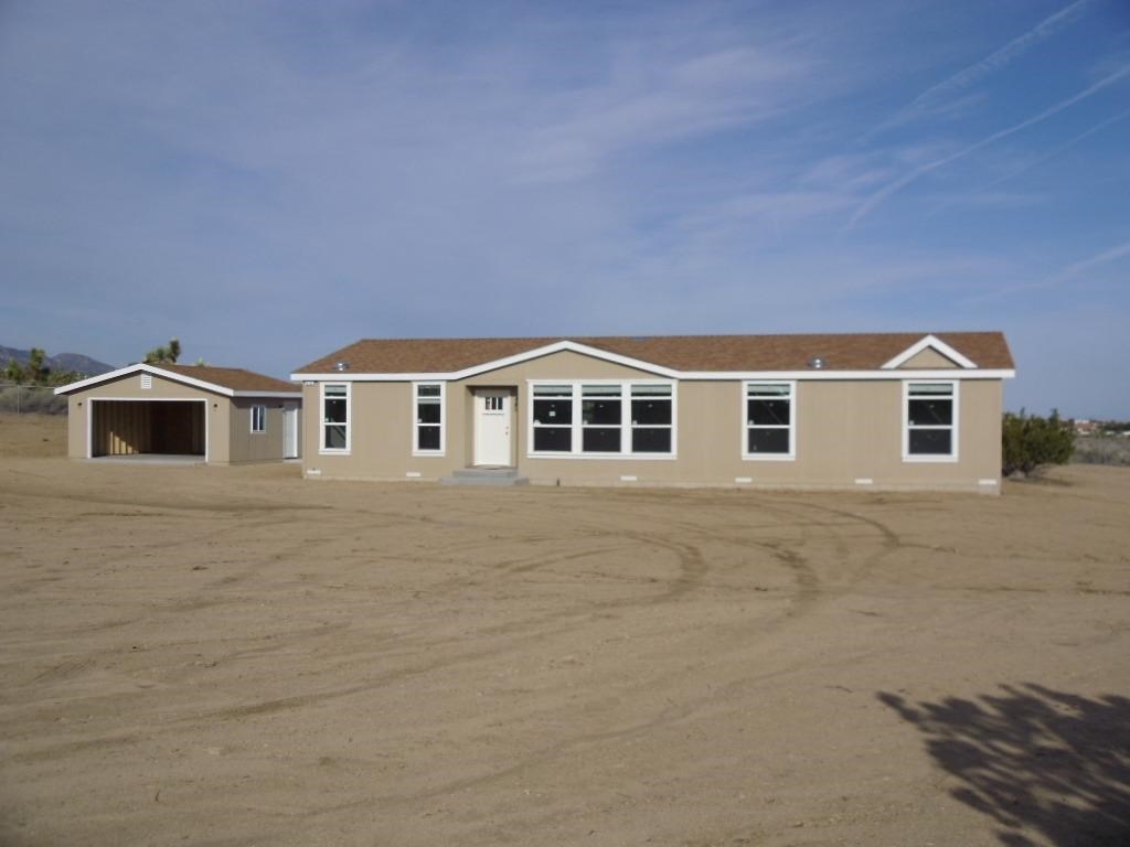 9132 Montara Road Phelan, CA 92371 - Photo 1 of 1 a house with a large space