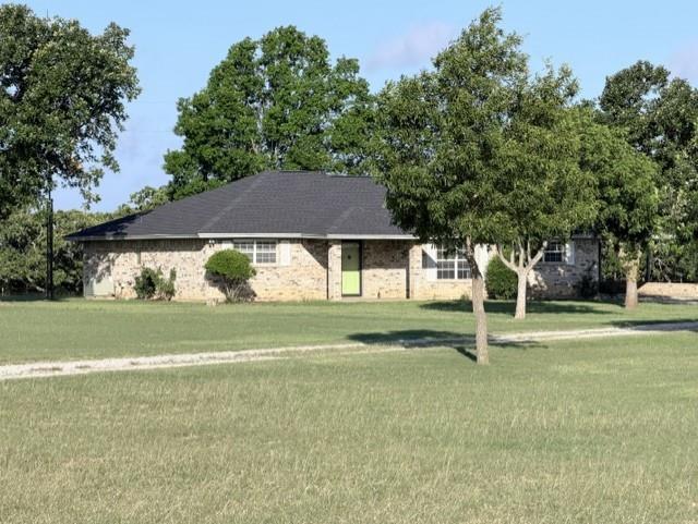 4316 Leona Road Bowie, TX 76230 - Photo 1 of 37 a front view of a house with a yard