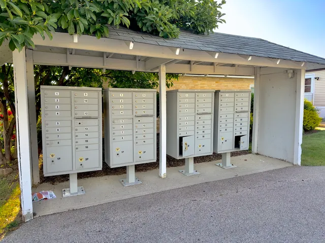 a view of a house with a large window and yard