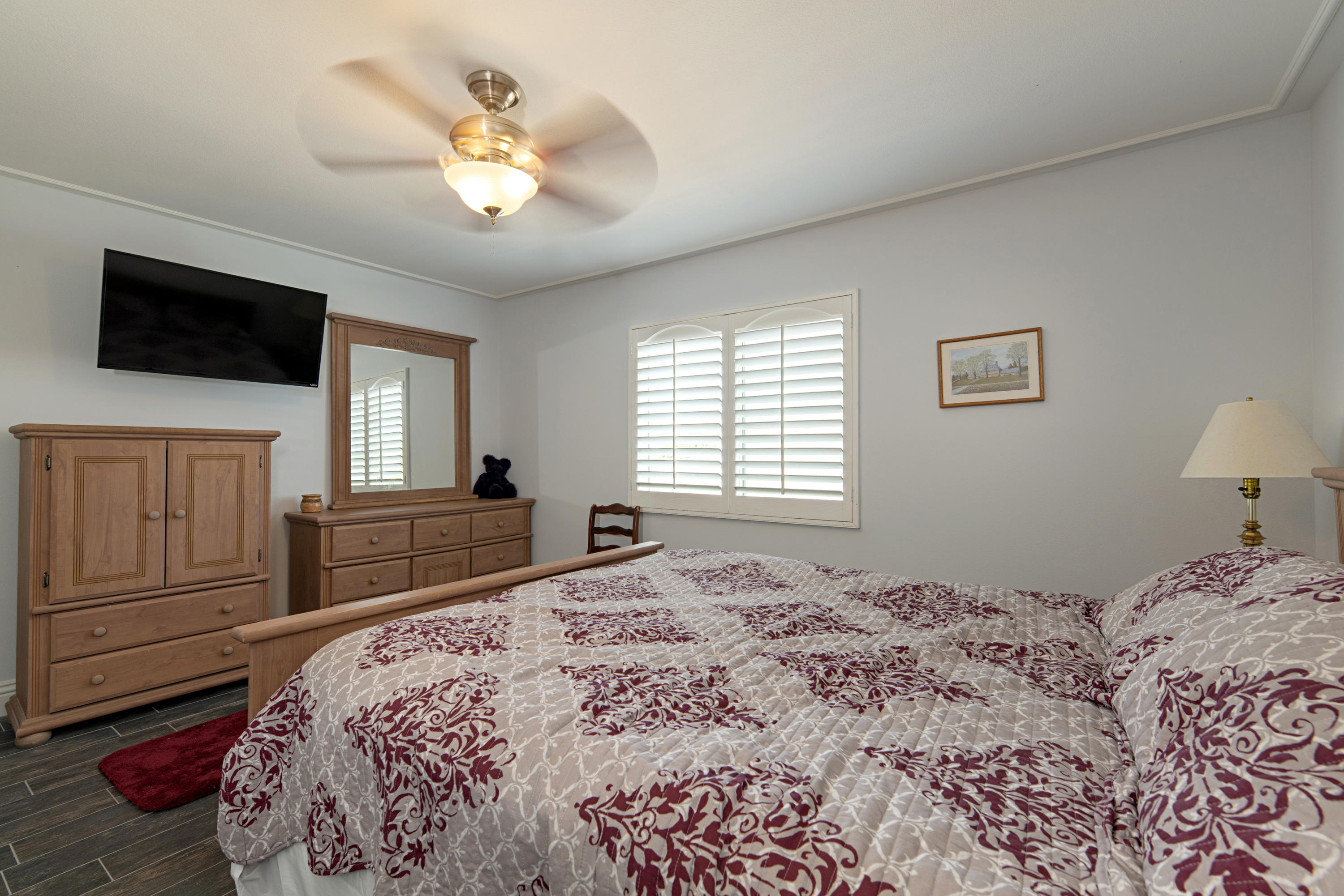 37431 Haweswater Road Indio, CA 92203 - Photo 22 of 41 a bedroom with a large bed and a flat screen tv