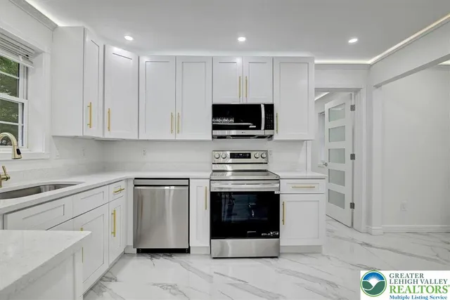 a kitchen with a stove and a microwave