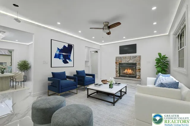 a living room with furniture and a fireplace