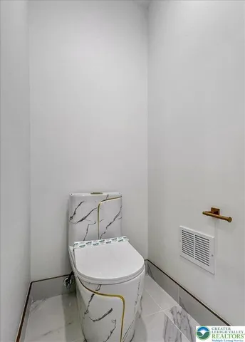a bathroom with a toilet and a sink
