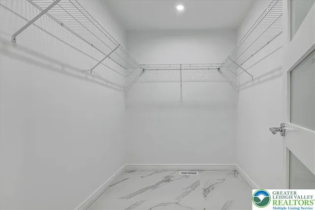 a view of a room with racks on the wall