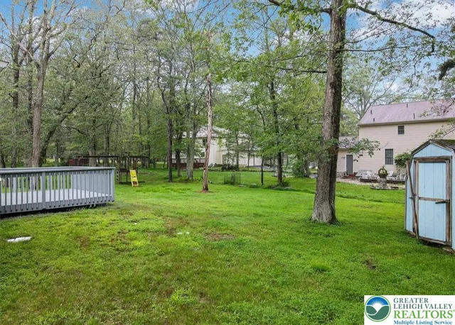 a view of backyard with green space