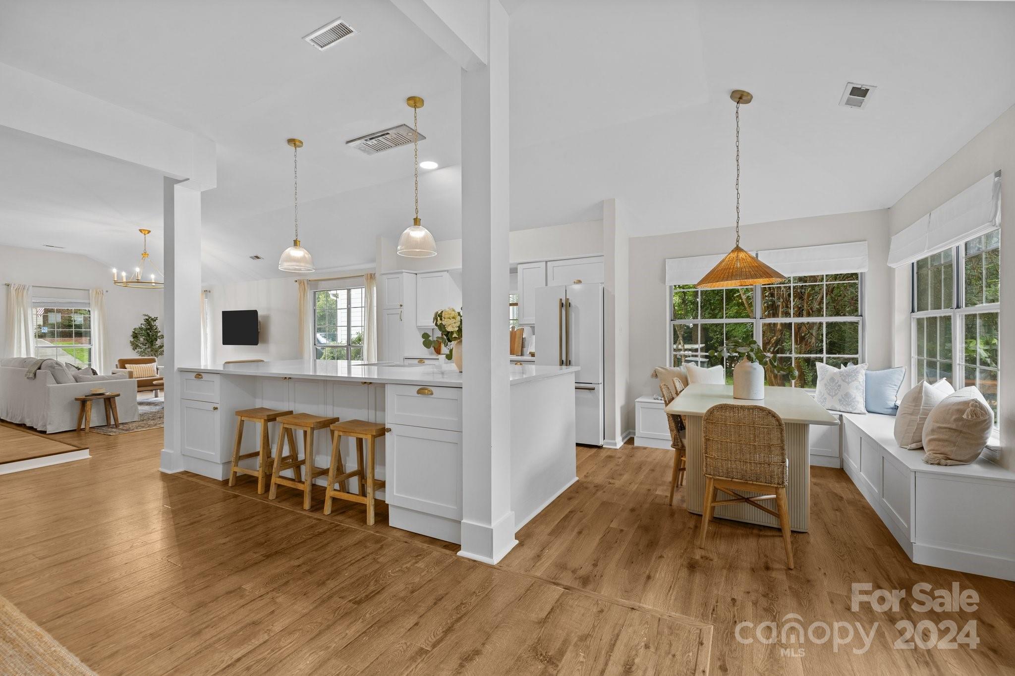 10527 Fairway Ridge Road Charlotte, NC 28277 - Photo 15 of 45 a dining room with furniture a chandelier and wooden floor