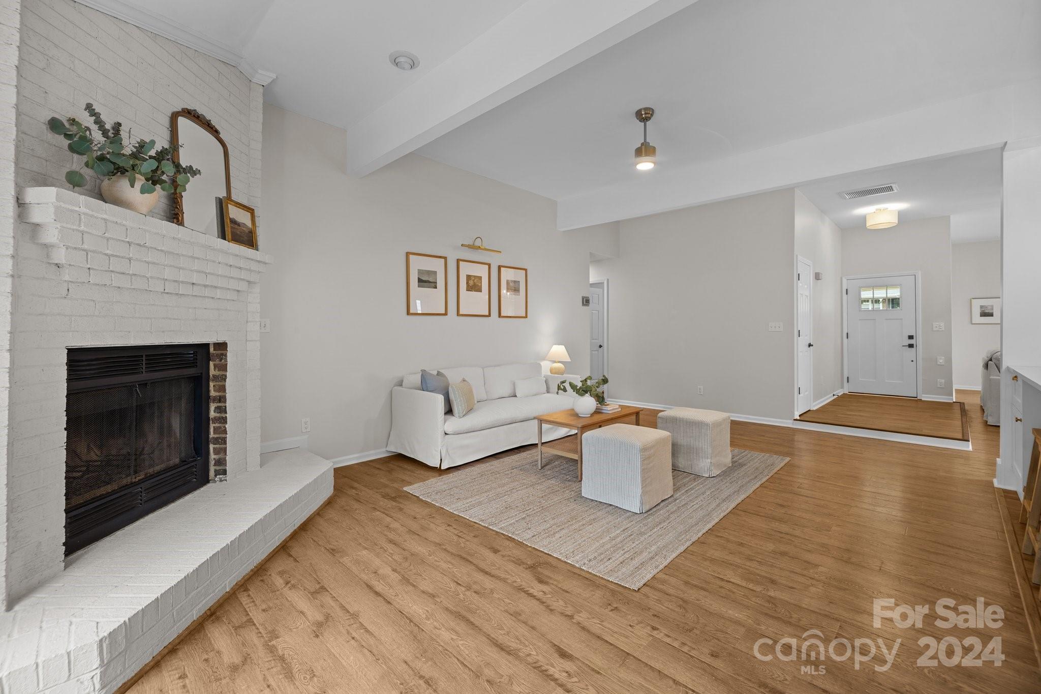 10527 Fairway Ridge Road Charlotte, NC 28277 - Photo 19 of 45 a living room with furniture and a fireplace