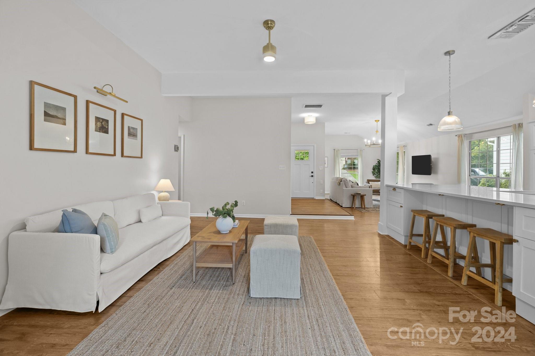 10527 Fairway Ridge Road Charlotte, NC 28277 - Photo 20 of 45 a living room with furniture and a wooden floor
