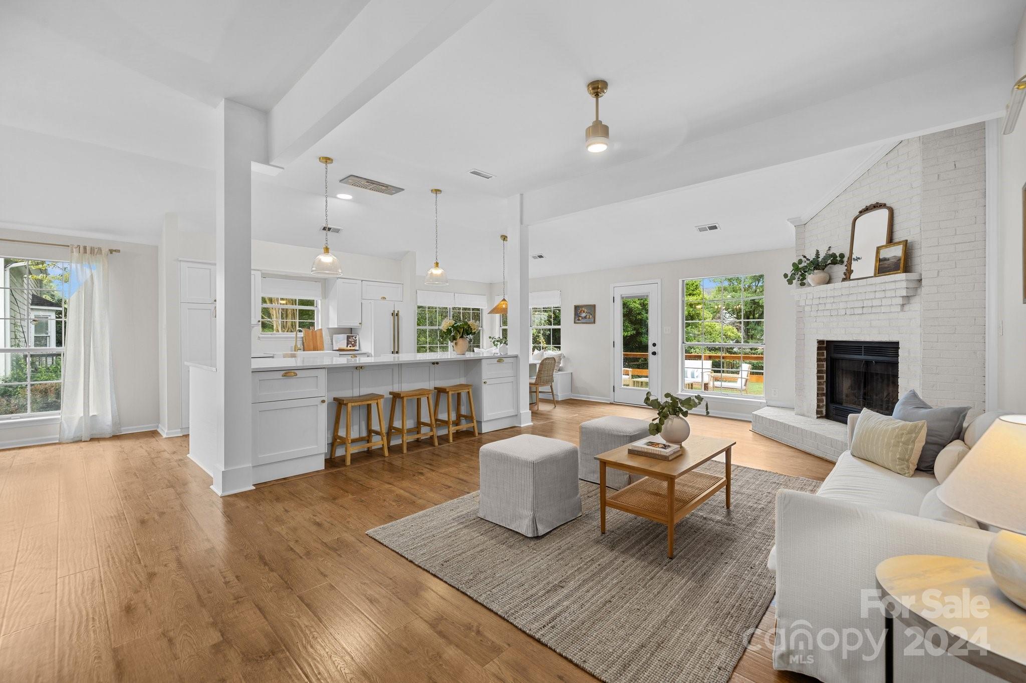 10527 Fairway Ridge Road Charlotte, NC 28277 - Photo 22 of 45 a living room with furniture and a fireplace