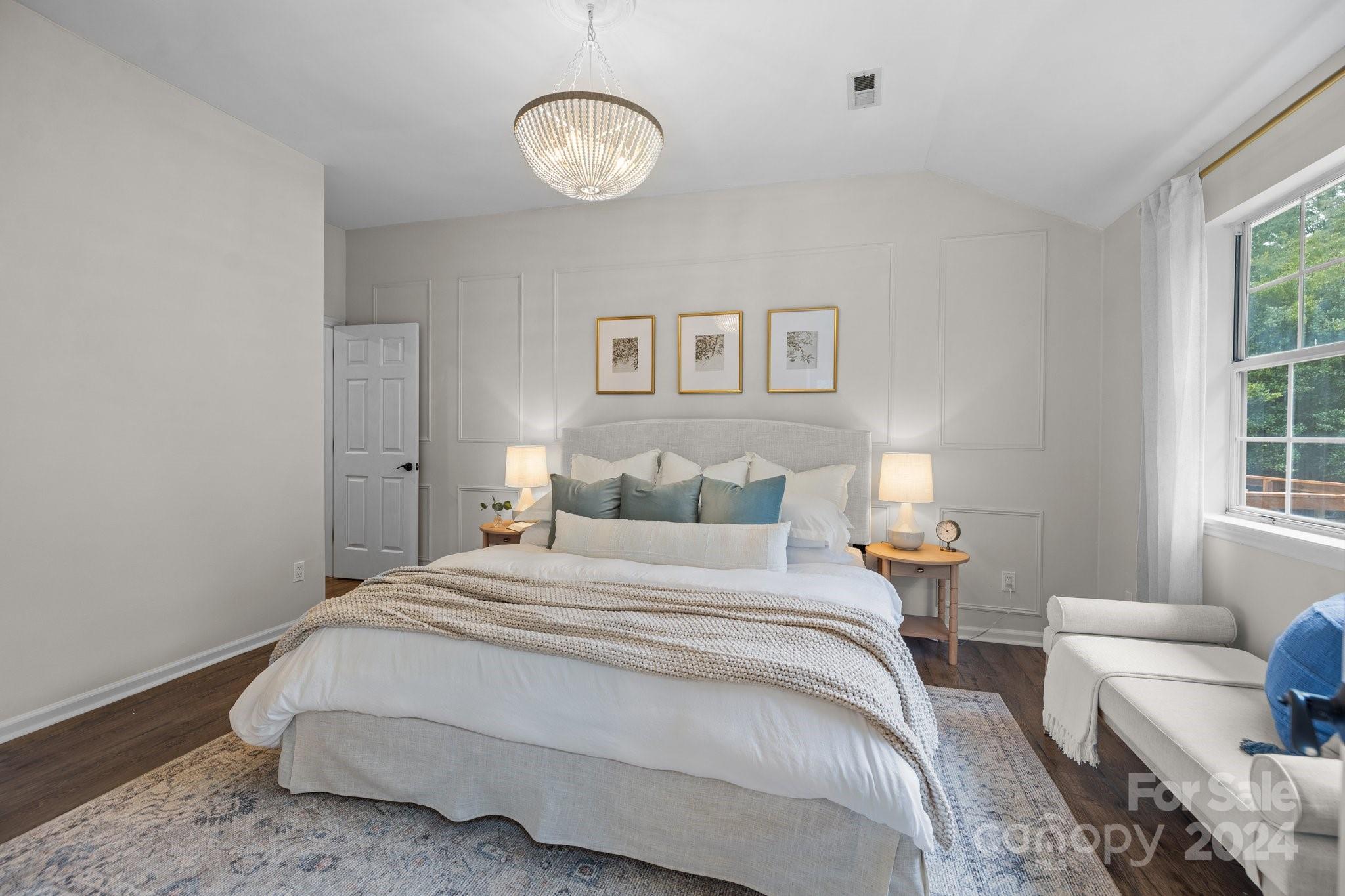 10527 Fairway Ridge Road Charlotte, NC 28277 - Photo 24 of 45 a bedroom with a bed and wooden floor