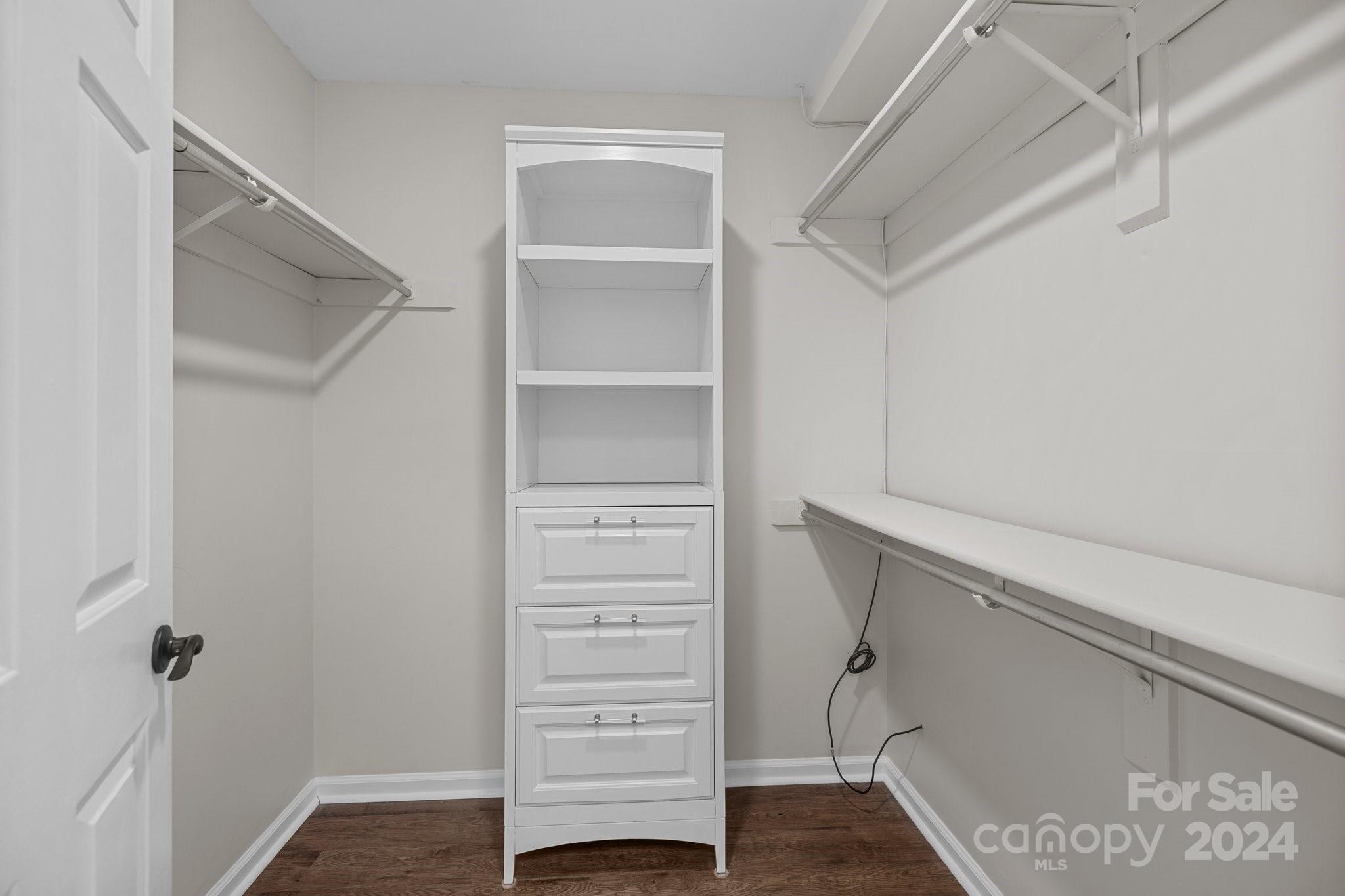 10527 Fairway Ridge Road Charlotte, NC 28277 - Photo 28 of 45 a view of walk in closet with empty racks