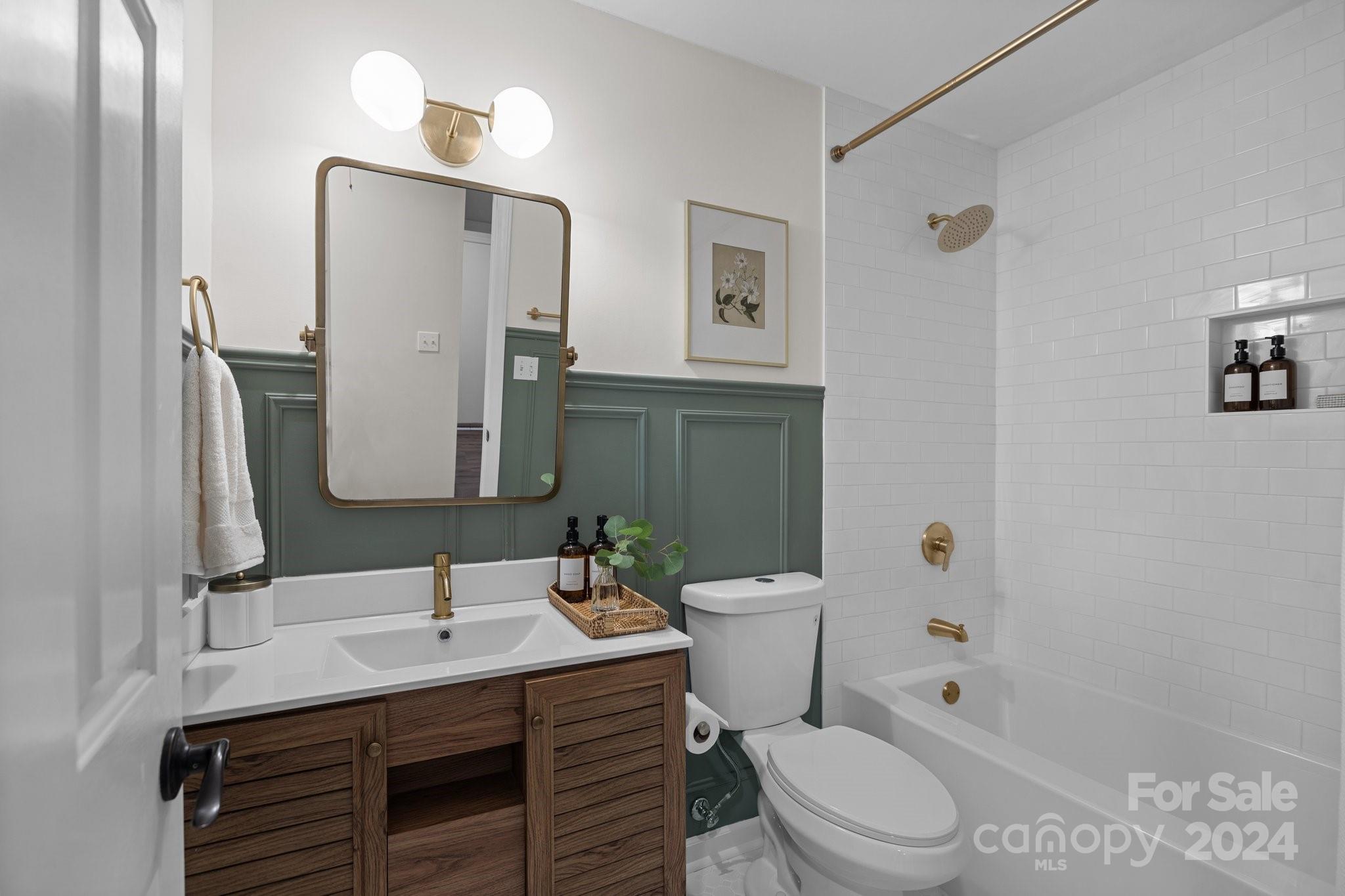 10527 Fairway Ridge Road Charlotte, NC 28277 - Photo 33 of 45 a bathroom with a toilet a sink and a mirror