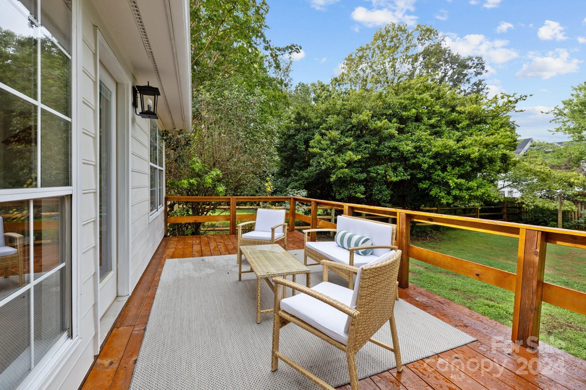 10527 Fairway Ridge Road Charlotte, NC 28277 - Photo 38 of 45 a balcony with wooden floor and outdoor seating