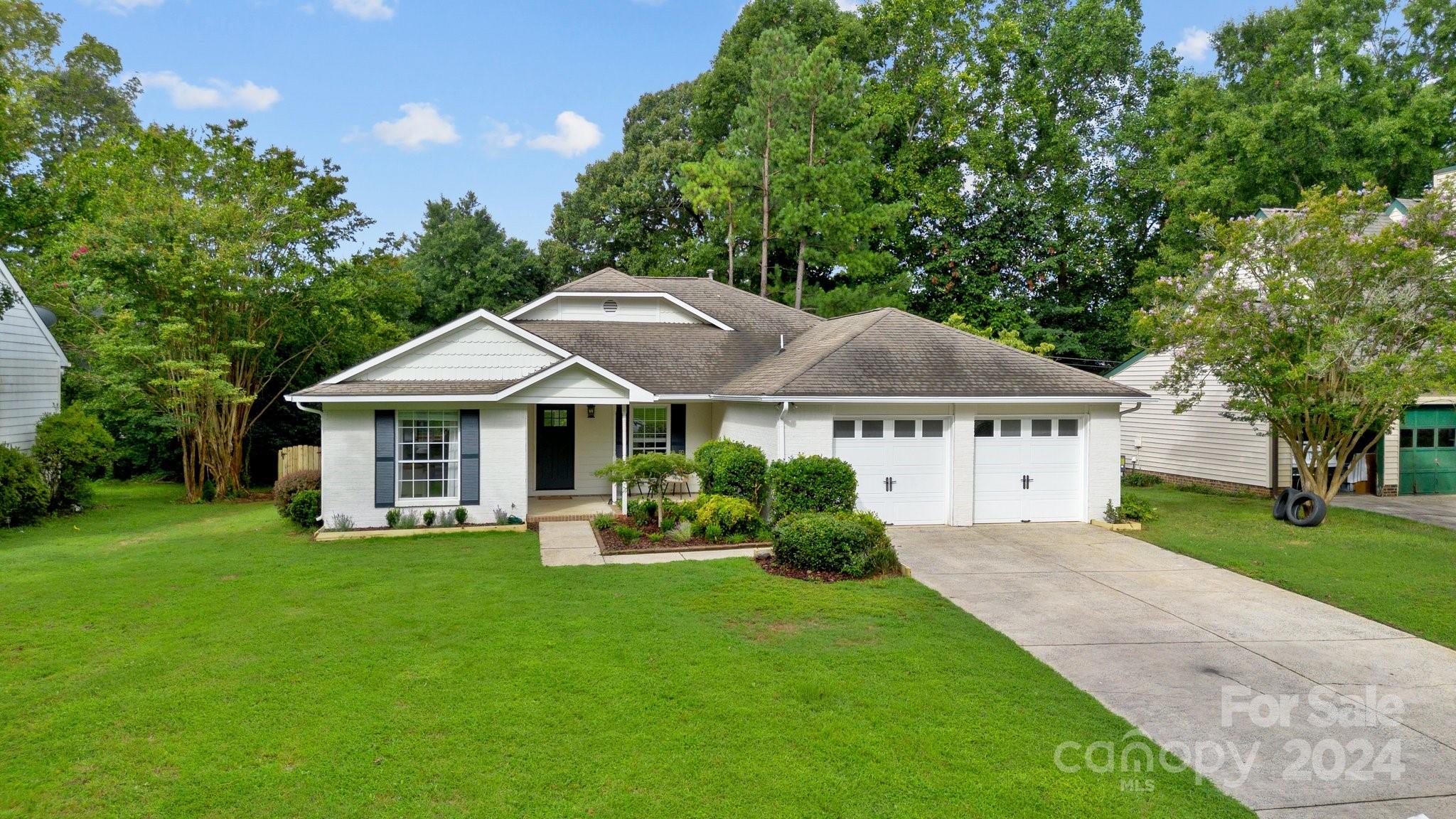 10527 Fairway Ridge Road Charlotte, NC 28277 - Photo 41 of 45 a front view of a house with a yard