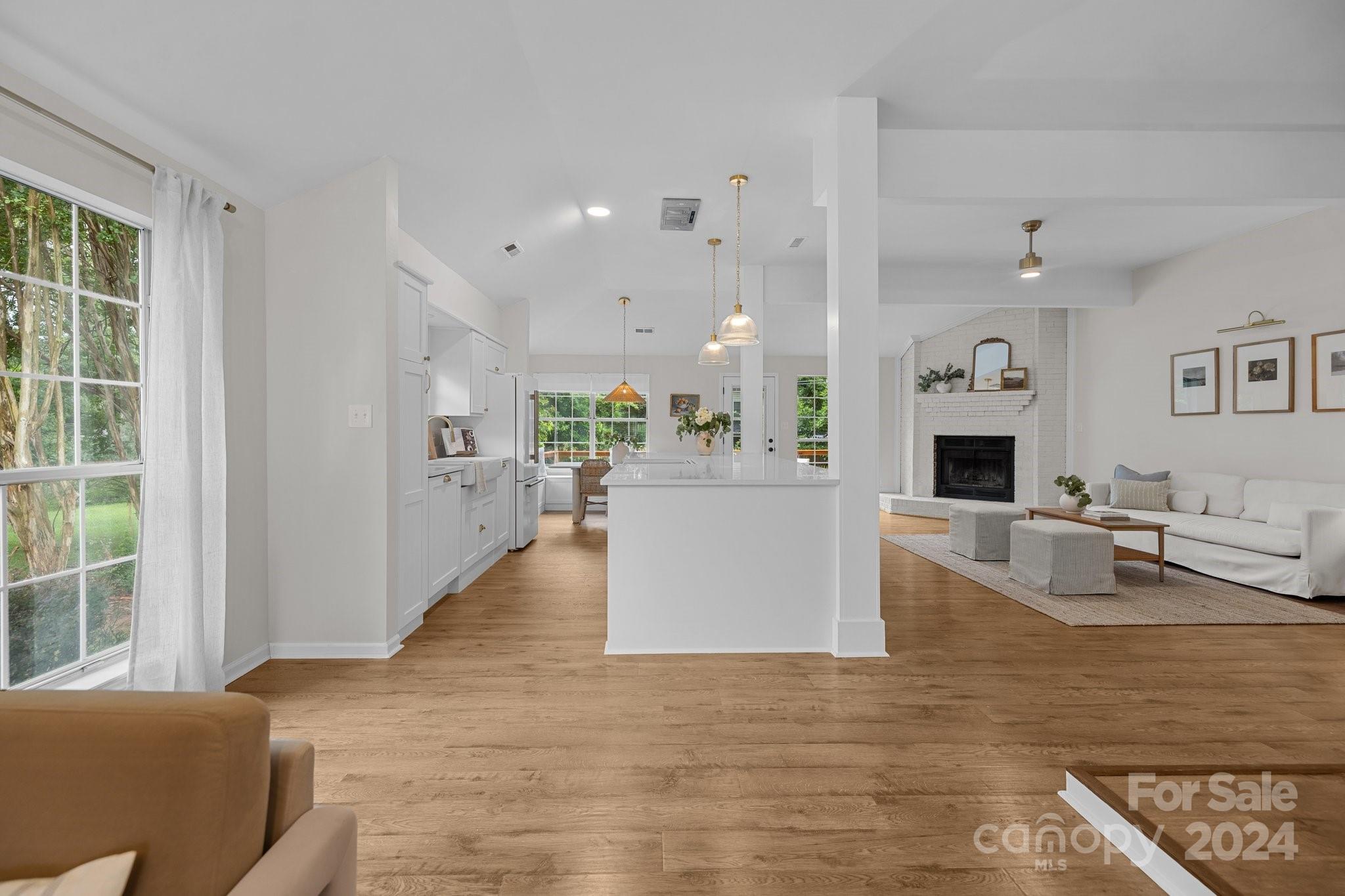 10527 Fairway Ridge Road Charlotte, NC 28277 - Photo 5 of 45 a living room with furniture and a fireplace