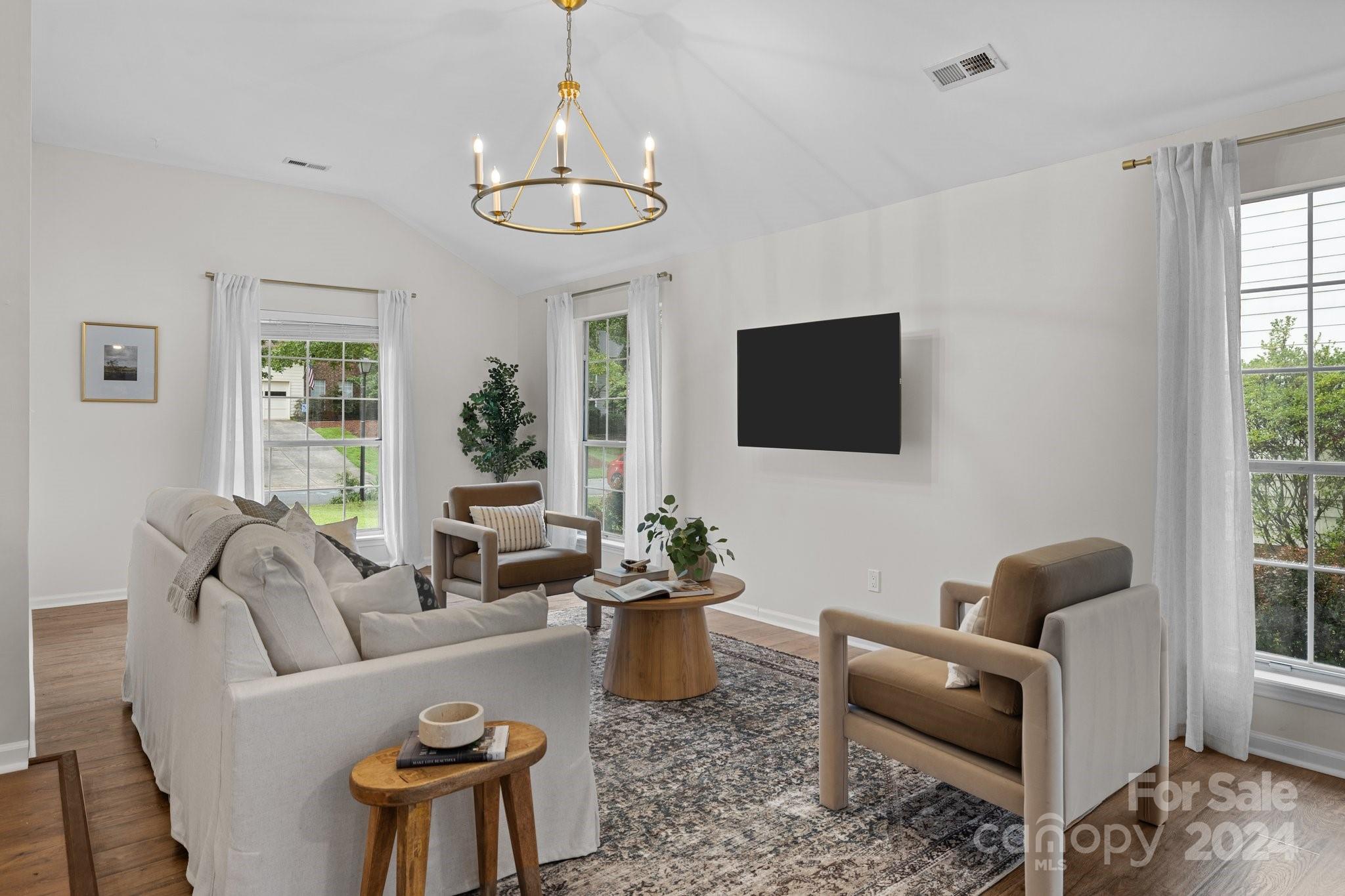 10527 Fairway Ridge Road Charlotte, NC 28277 - Photo 7 of 45 a living room with furniture a flat screen tv and a large window