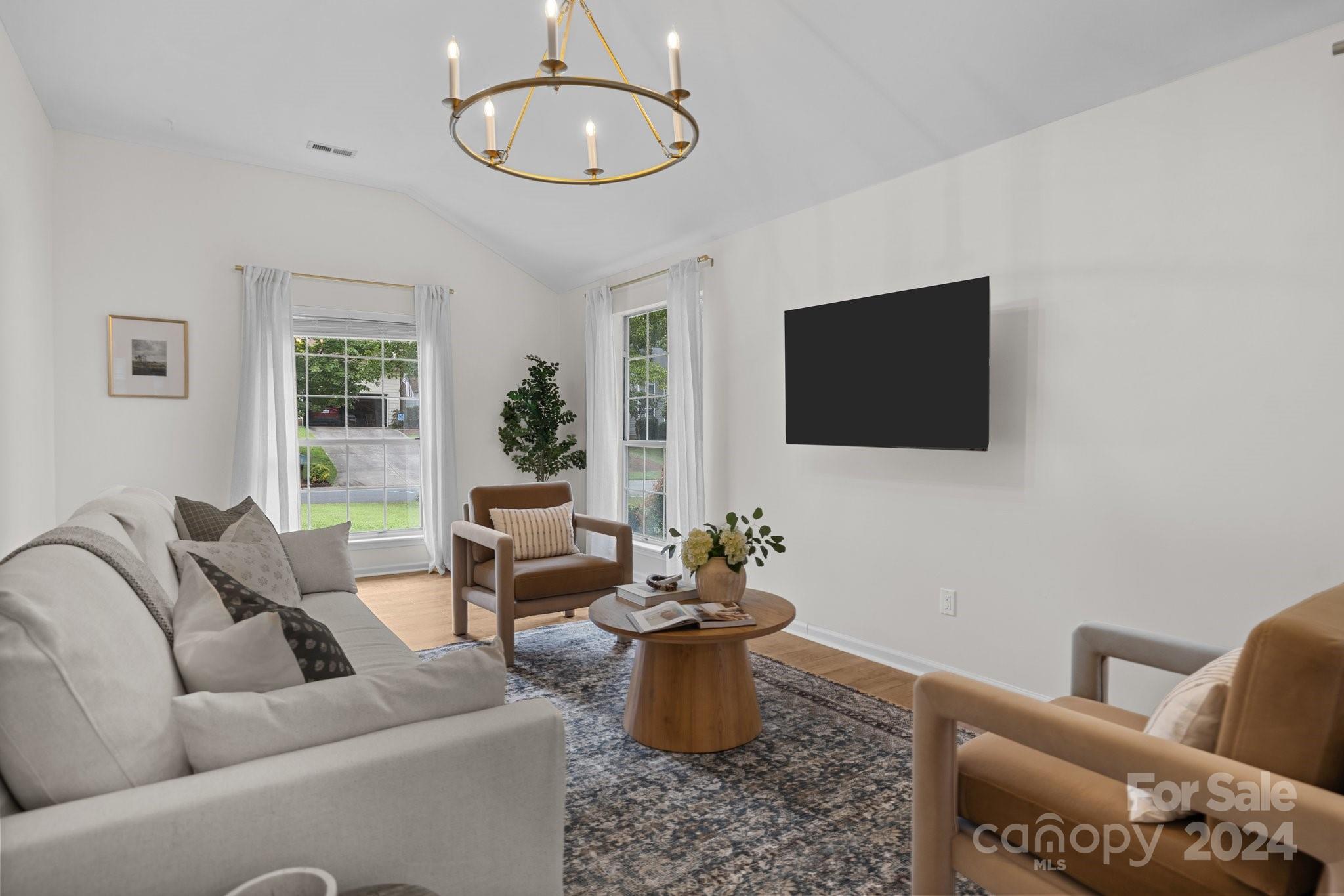 10527 Fairway Ridge Road Charlotte, NC 28277 - Photo 9 of 45 a living room with furniture and a flat screen tv