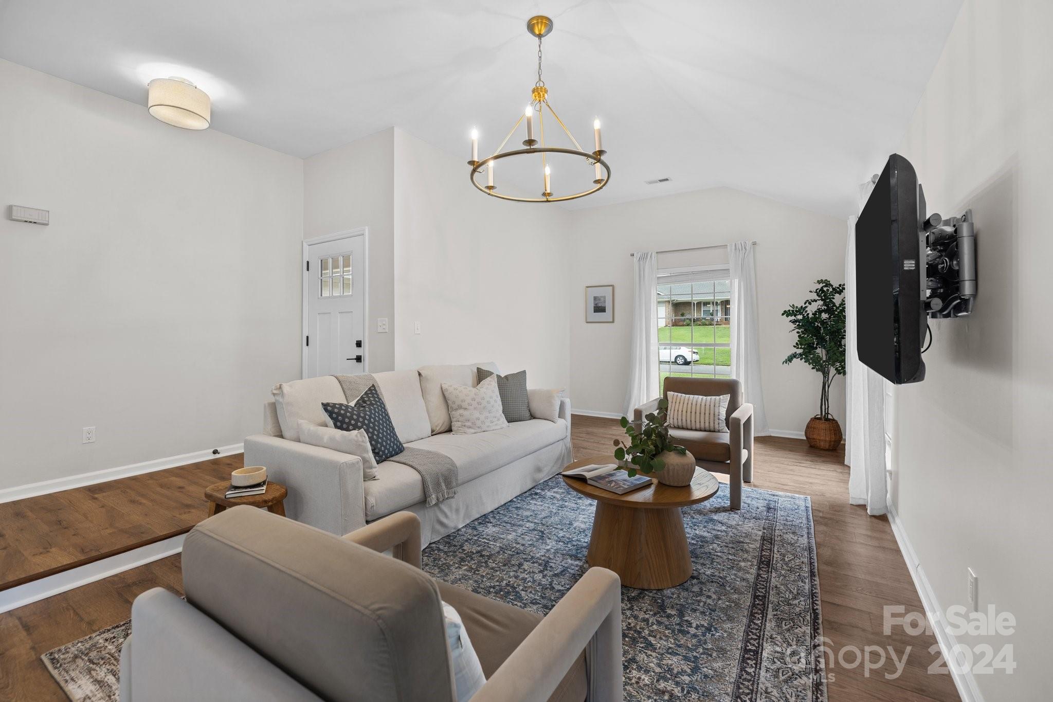 10527 Fairway Ridge Road Charlotte, NC 28277 - Photo 10 of 45 a living room with furniture flowerpot and wooden floor