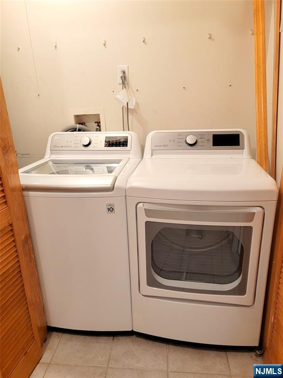 430 Elm Street, Unit 2 Kearny, NJ 07032 - Photo 14 of 14 a utility room with dryer and washer