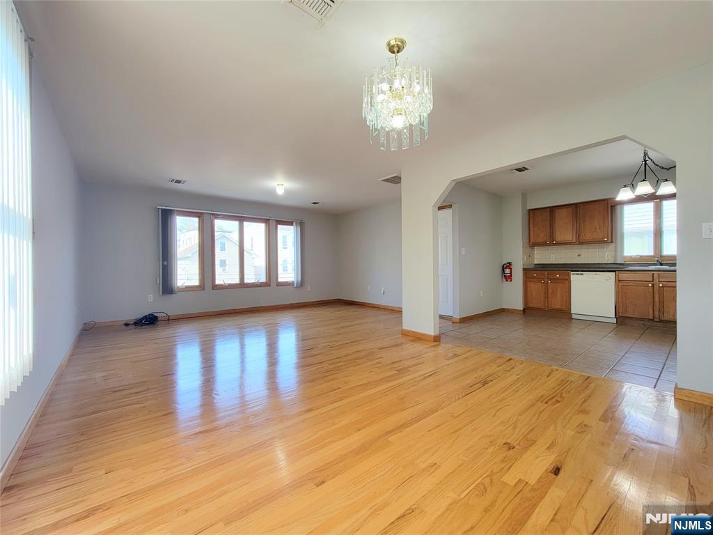 430 Elm Street, Unit 2 Kearny, NJ 07032 - Photo 5 of 14 a view of a livingroom with a furniture wooden floor and chandelier