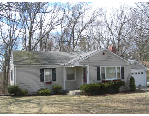 934 Bradley Road Springfield, MA 01109 - Photo 1 of 1 a front view of a house with yard and parking