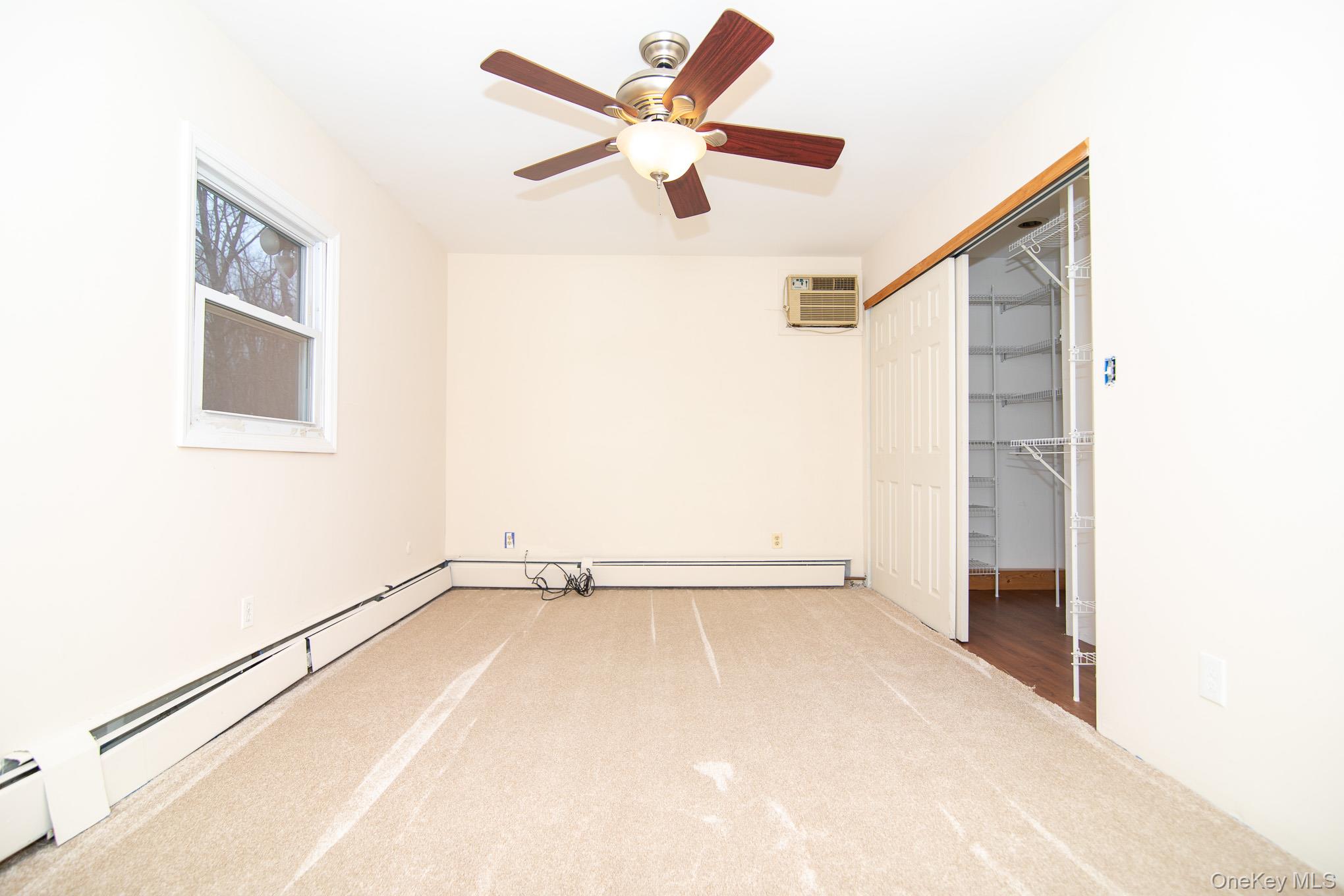 172 Farmingdale Road Blooming Grove, NY 10918 - Photo 17 of 44 a view of an empty room with a window