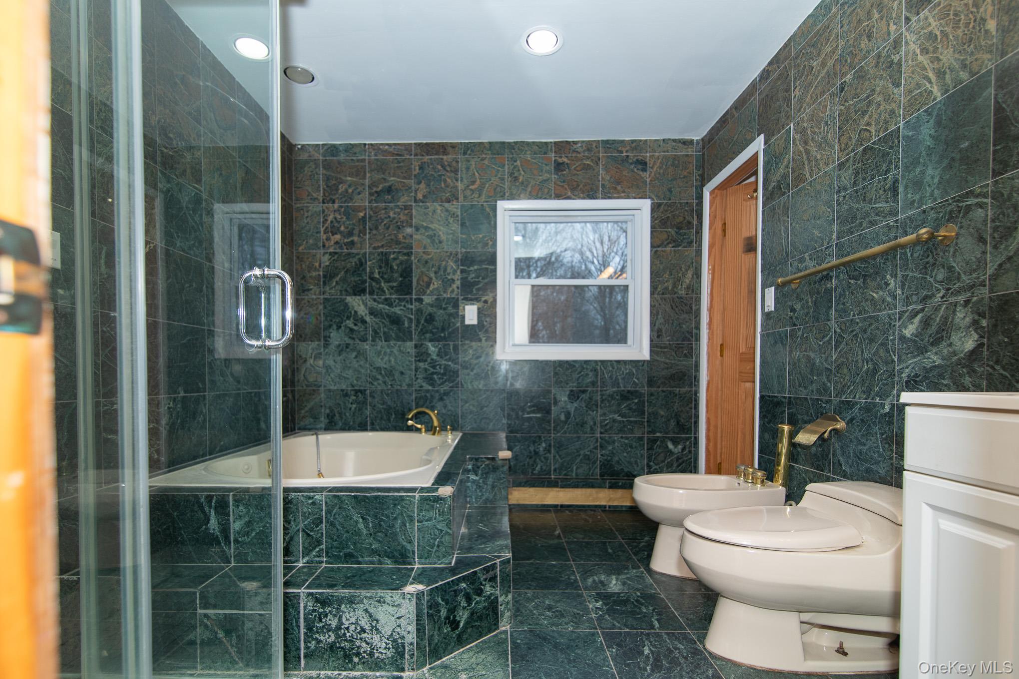 172 Farmingdale Road Blooming Grove, NY 10918 - Photo 19 of 44 a bathroom with a sink a toilet and shower