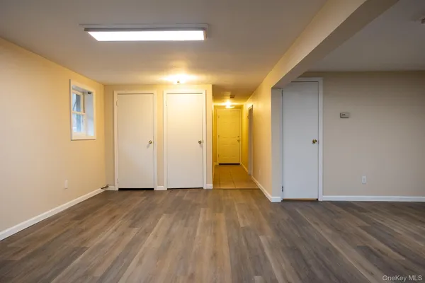 a view of wooden floor in an empty room