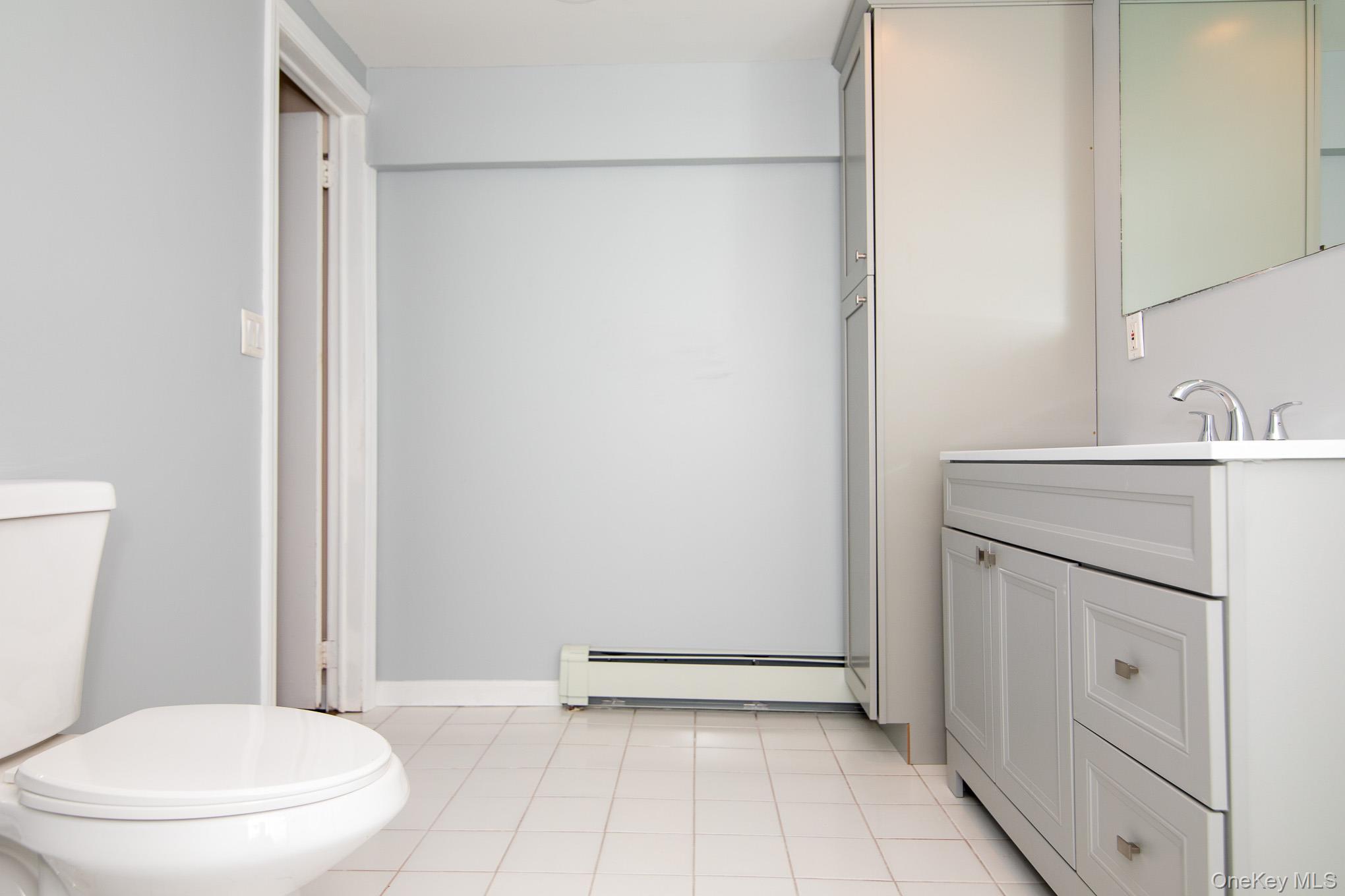 172 Farmingdale Road Blooming Grove, NY 10918 - Photo 32 of 44 a bathroom with a sink a toilet and shower