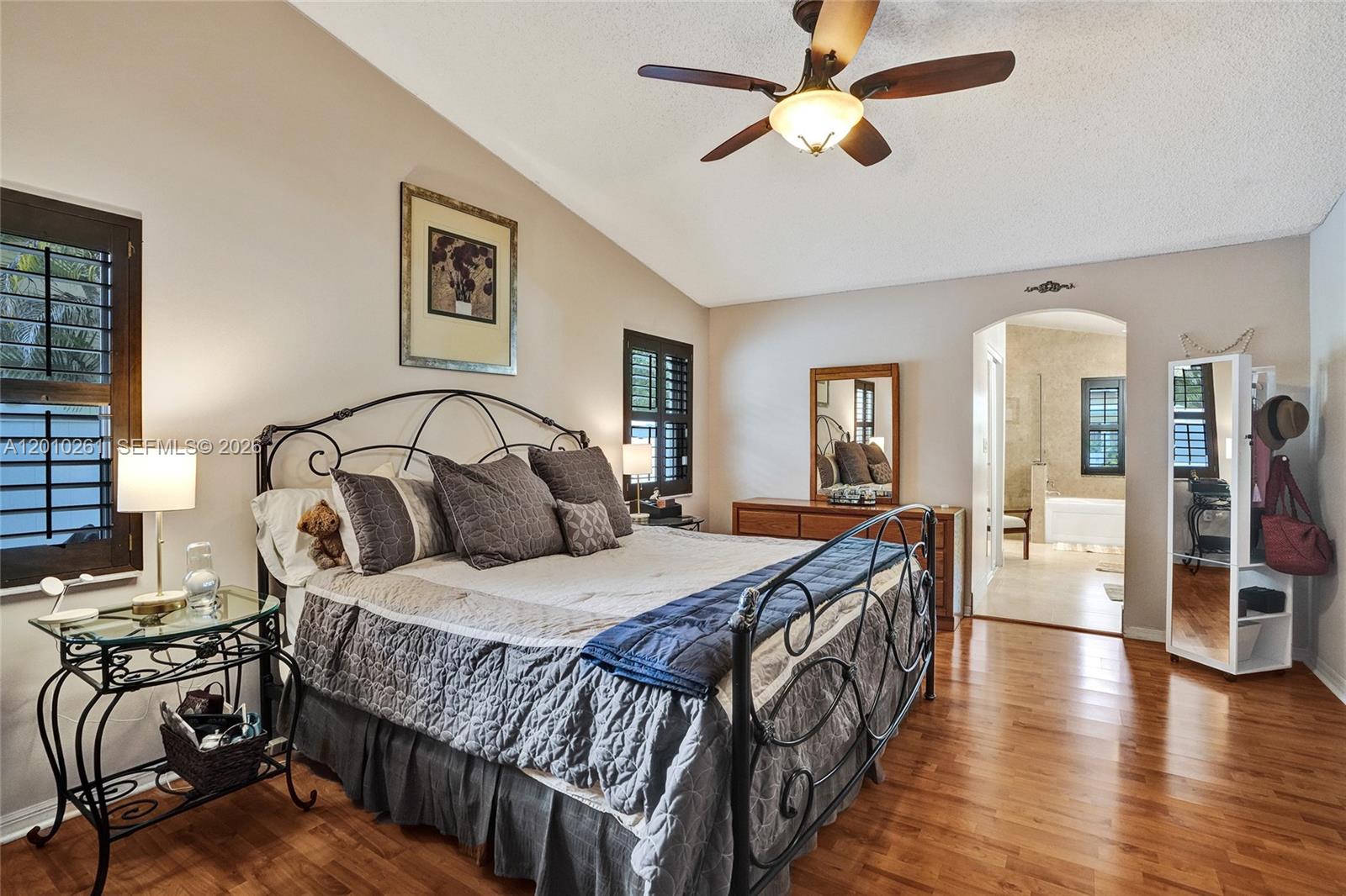 13621 Southwest 18th Street Miramar, FL 33027 - Photo 18 of 45 a bedroom with bed and wooden floors
