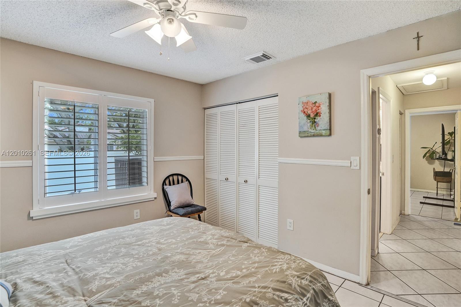 13621 Southwest 18th Street Miramar, FL 33027 - Photo 23 of 45 a bedroom with a bed and a window