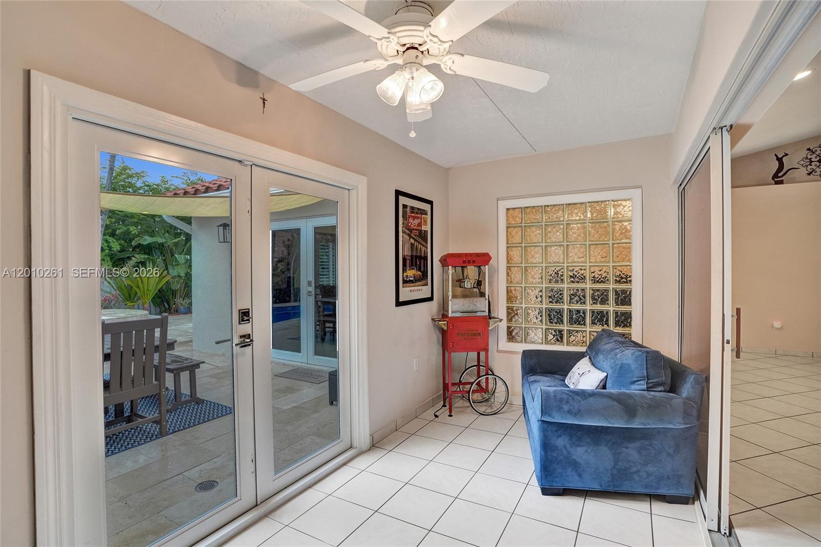 13621 Southwest 18th Street Miramar, FL 33027 - Photo 27 of 45 a living room with furniture and a chandelier