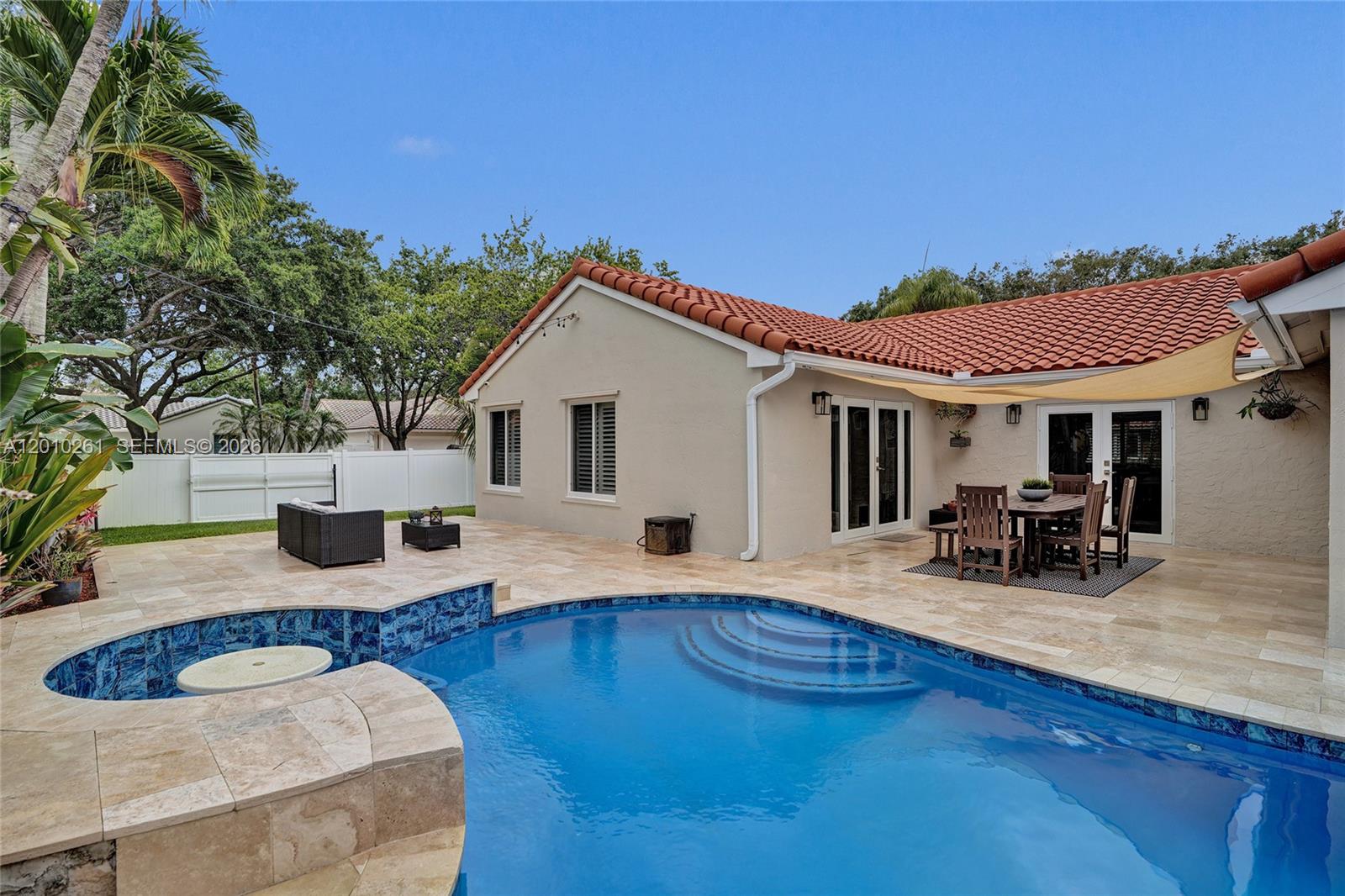 13621 Southwest 18th Street Miramar, FL 33027 - Photo 34 of 45 a view of house with patio outdoor seating
