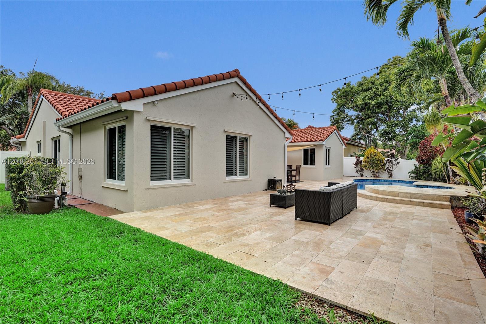 13621 Southwest 18th Street Miramar, FL 33027 - Photo 36 of 45 a view of a house with backyard and sitting area