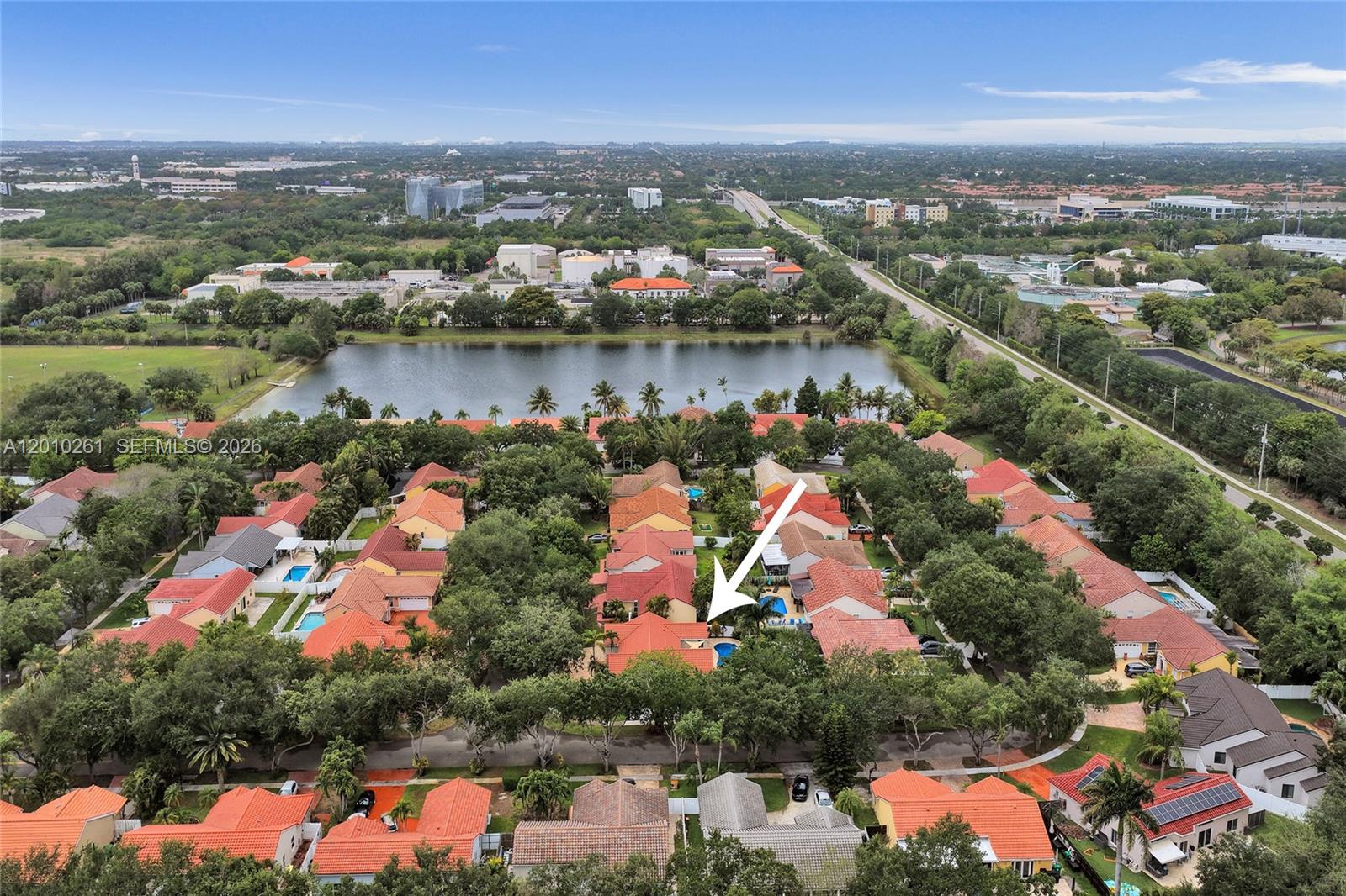 13621 Southwest 18th Street Miramar, FL 33027 - Photo 41 of 45 an aerial view of city and lake with trees