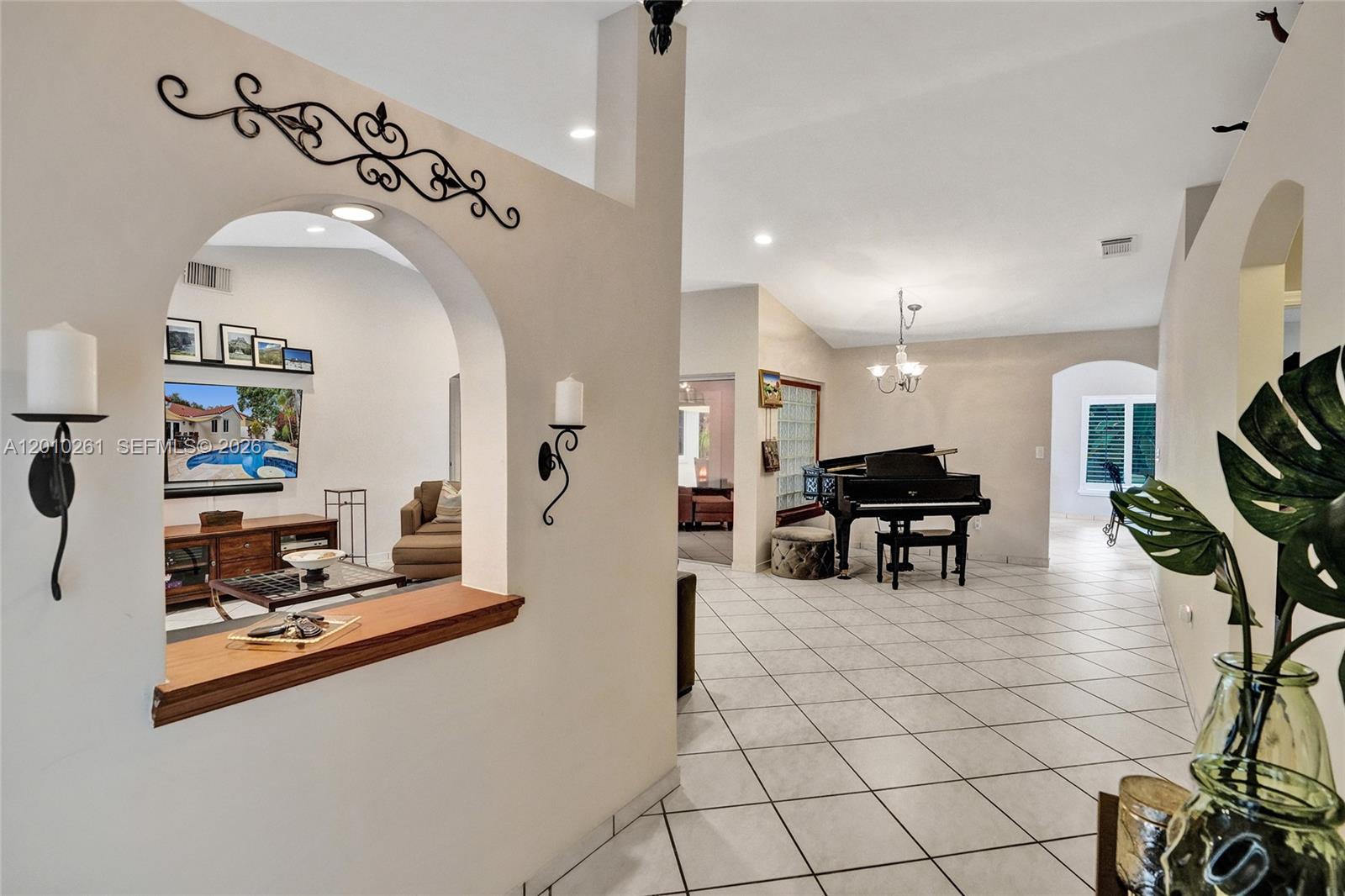 13621 Southwest 18th Street Miramar, FL 33027 - Photo 7 of 45 a view of kitchen center island and dining table