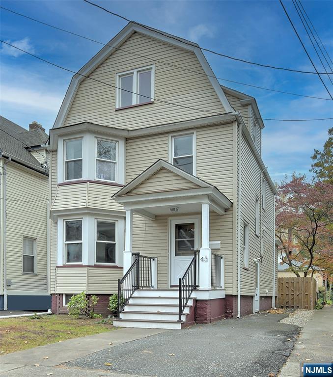 a front view of a house with a garage